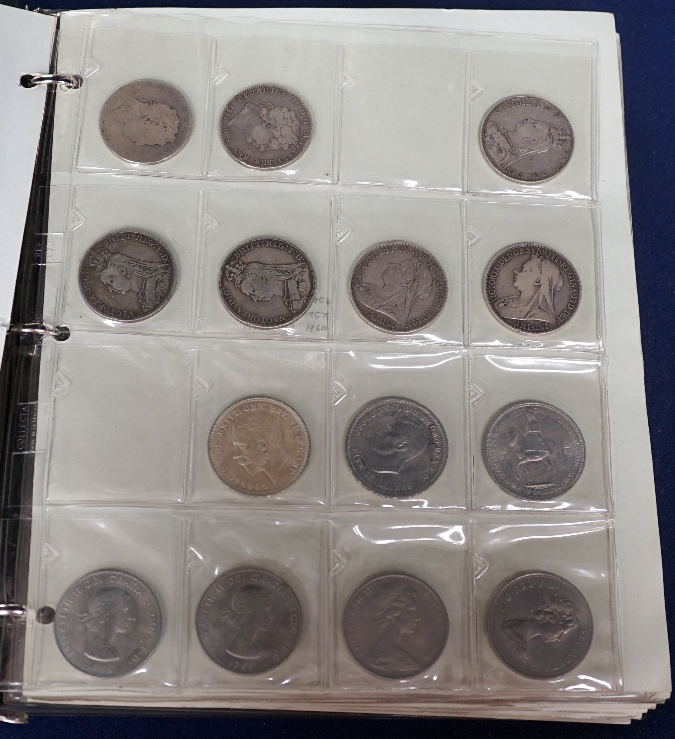 An album of British crowns, halfcrowns, florins and decimal 50 pence and 20 pence coins, including 1819 crown F, etc. and various loose UK coins and banknotes in envelopes